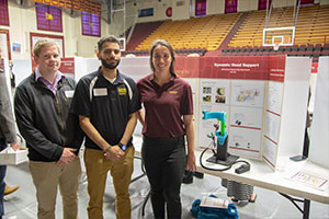 Students pose in front of presentation at Celebrate Gannon