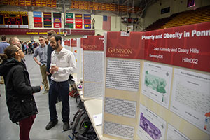 Students pose in front of presentation at Celebrate Gannon