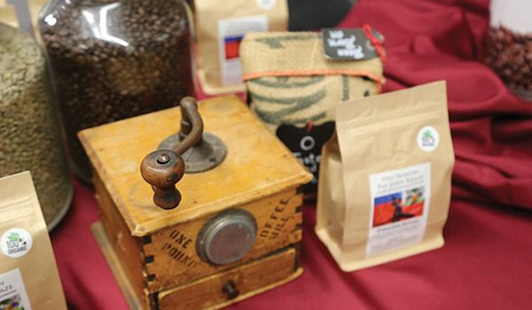 Neg Mawon coffee is displayed in the Nash Library as students share their ABST experience.