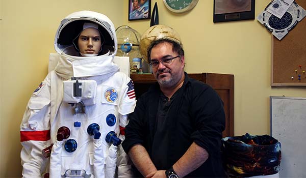 David Horne poses with a replica of the Apollo A7-LB spacesuit.